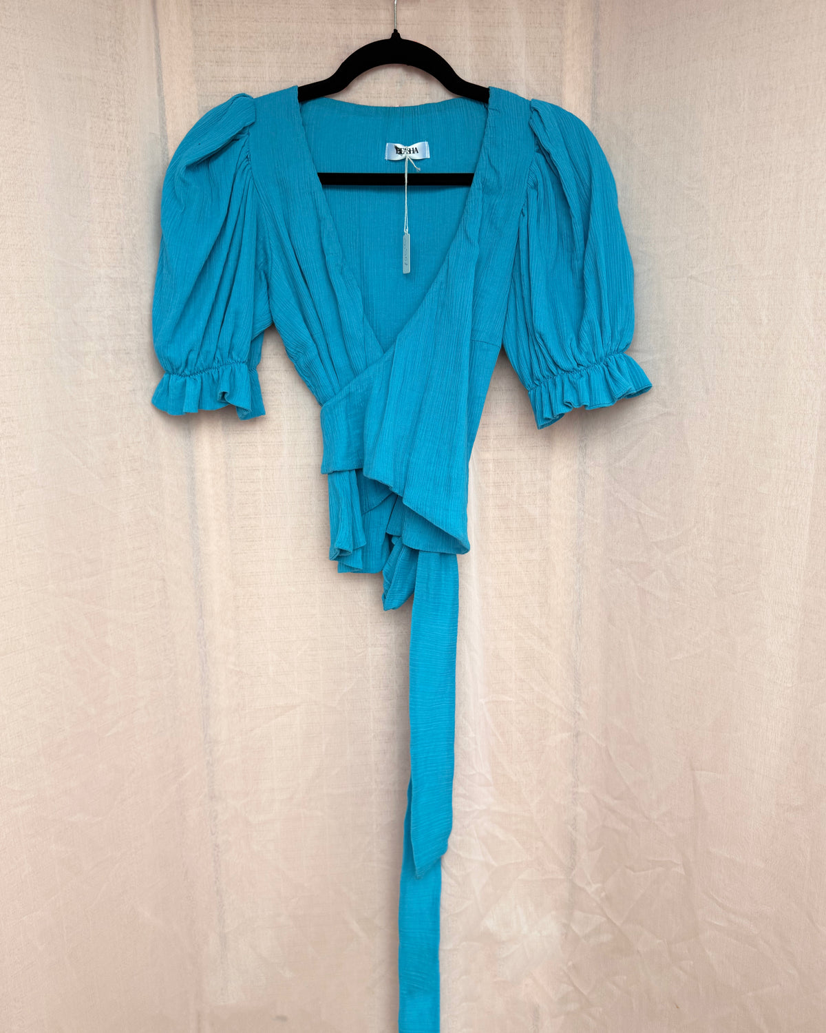 26. The Nina Wrap Top in Kingfisher Blue - L